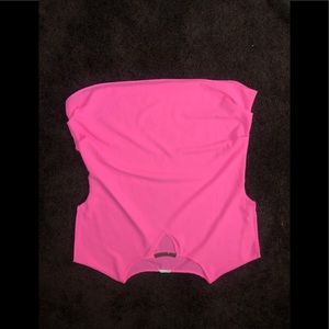 A pink shirt with a gold neckline